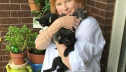 Debbie Archer holding a foster kitten